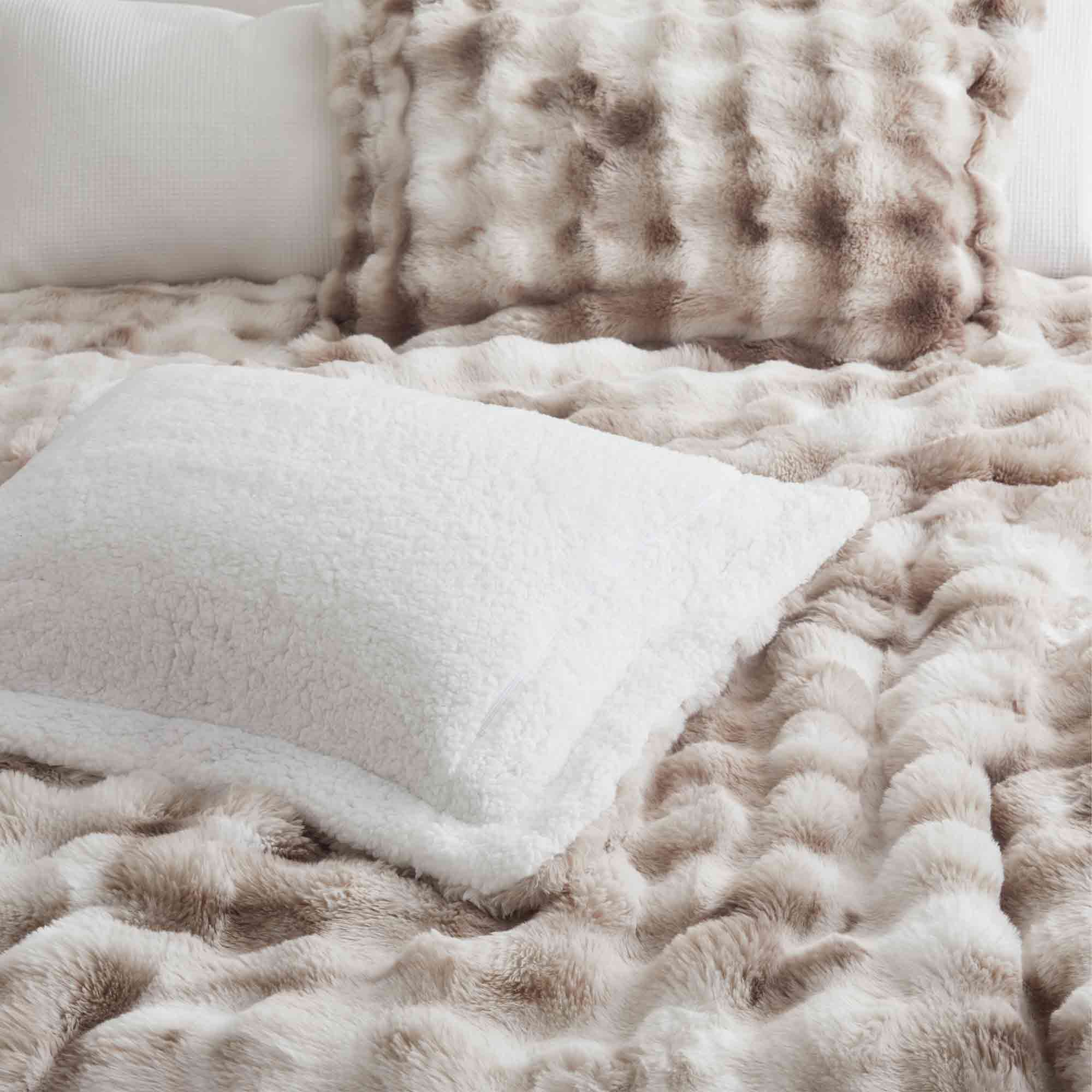 Soft Taupe offers cozy elegance for the cold season. This 3-piece reversible faux rabbit fur comforter set features an ultra-soft, velvety texture paired with a plush sherpa reverse, providing exceptional warmth and comfort during chilly nights. The soothing blend of beige and gray tones adds a touch of sophistication to any bedroom, making it the perfect choice for a stylish, snug winter retreat.