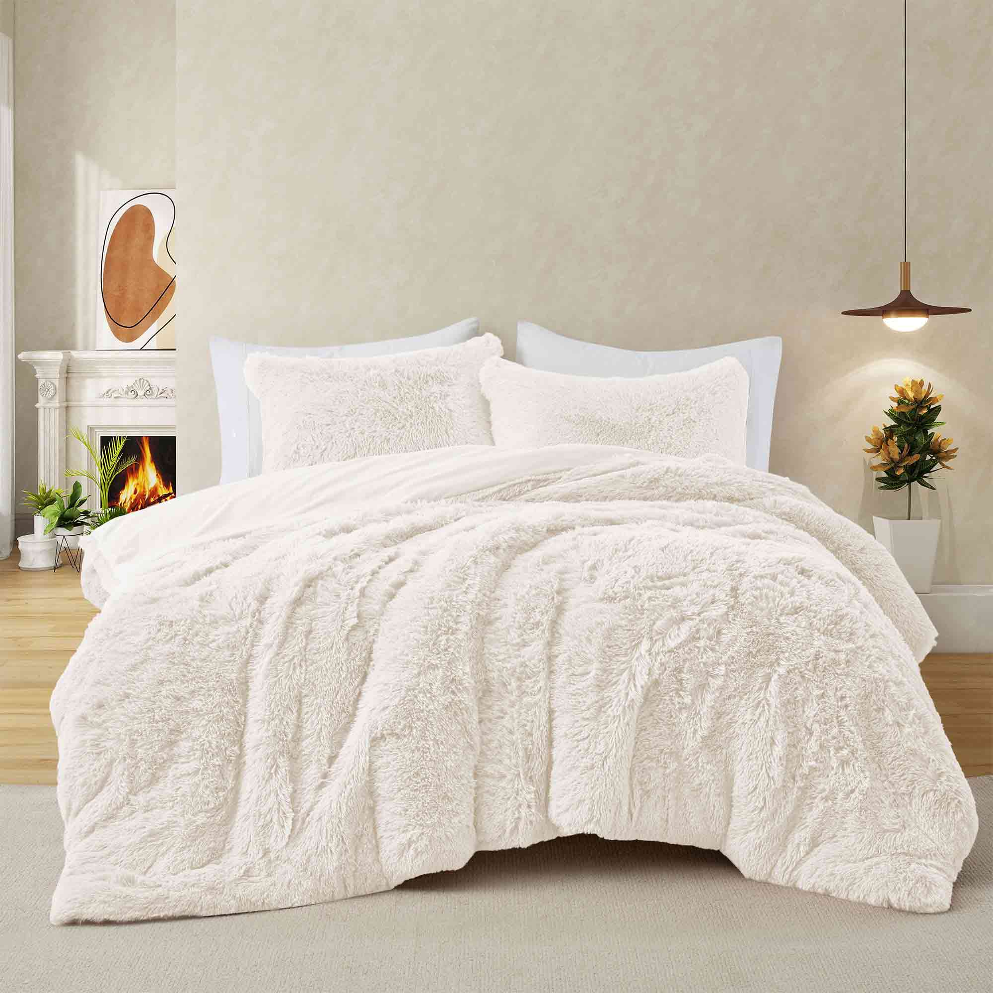 Brighten your winter nights with the 3-Piece Plush Reversible Faux Fur Comforter Set in Cream. Designed for cold weather, this set combines fluffy faux fur with a silky-smooth reverse, creating a light yet luxuriously warm bedding choice.