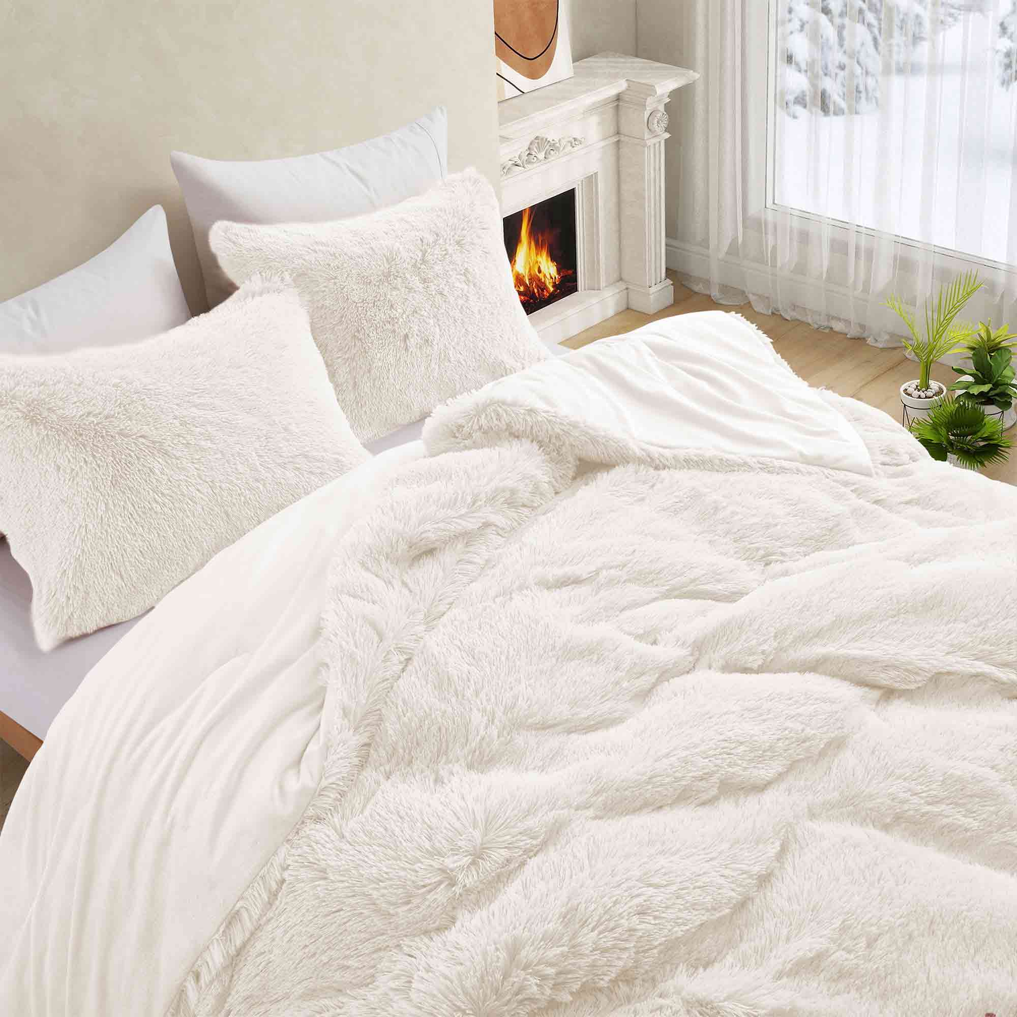 Brighten your winter nights with the 3-Piece Plush Reversible Faux Fur Comforter Set in Cream. Designed for cold weather, this set combines fluffy faux fur with a silky-smooth reverse, creating a light yet luxuriously warm bedding choice.