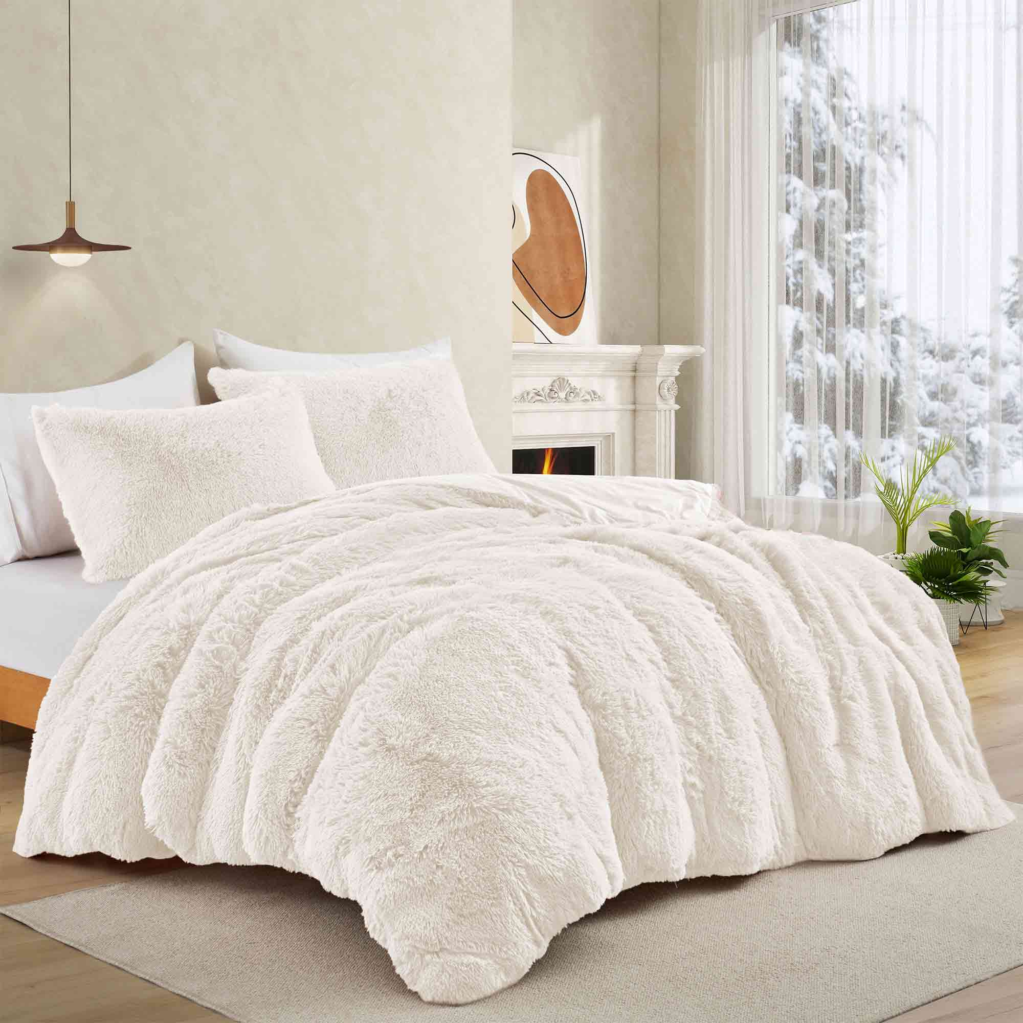 Brighten your winter nights with the 3-Piece Plush Reversible Faux Fur Comforter Set in Cream. Designed for cold weather, this set combines fluffy faux fur with a silky-smooth reverse, creating a light yet luxuriously warm bedding choice.