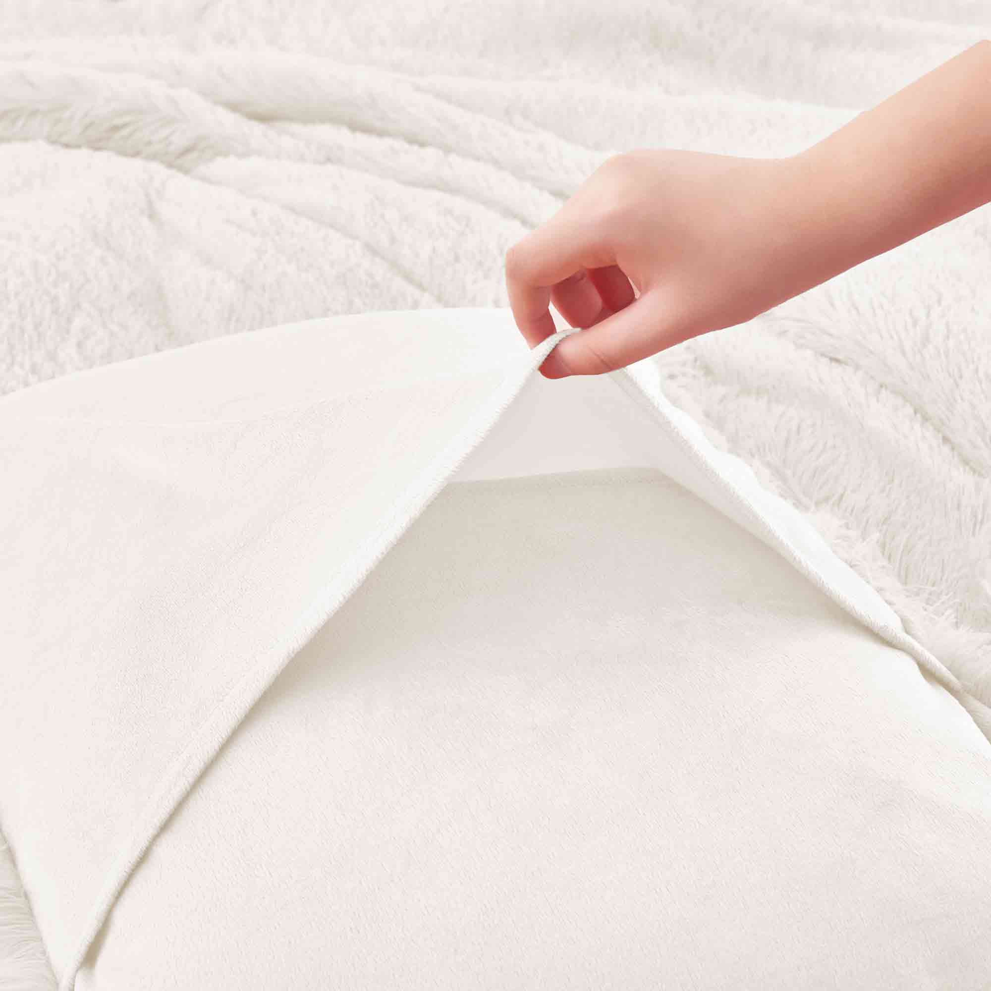 Brighten your winter nights with the 3-Piece Plush Reversible Faux Fur Comforter Set in Cream. Designed for cold weather, this set combines fluffy faux fur with a silky-smooth reverse, creating a light yet luxuriously warm bedding choice.