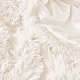 Brighten your winter nights with the 3-Piece Plush Reversible Faux Fur Comforter Set in Cream. Designed for cold weather, this set combines fluffy faux fur with a silky-smooth reverse, creating a light yet luxuriously warm bedding choice.