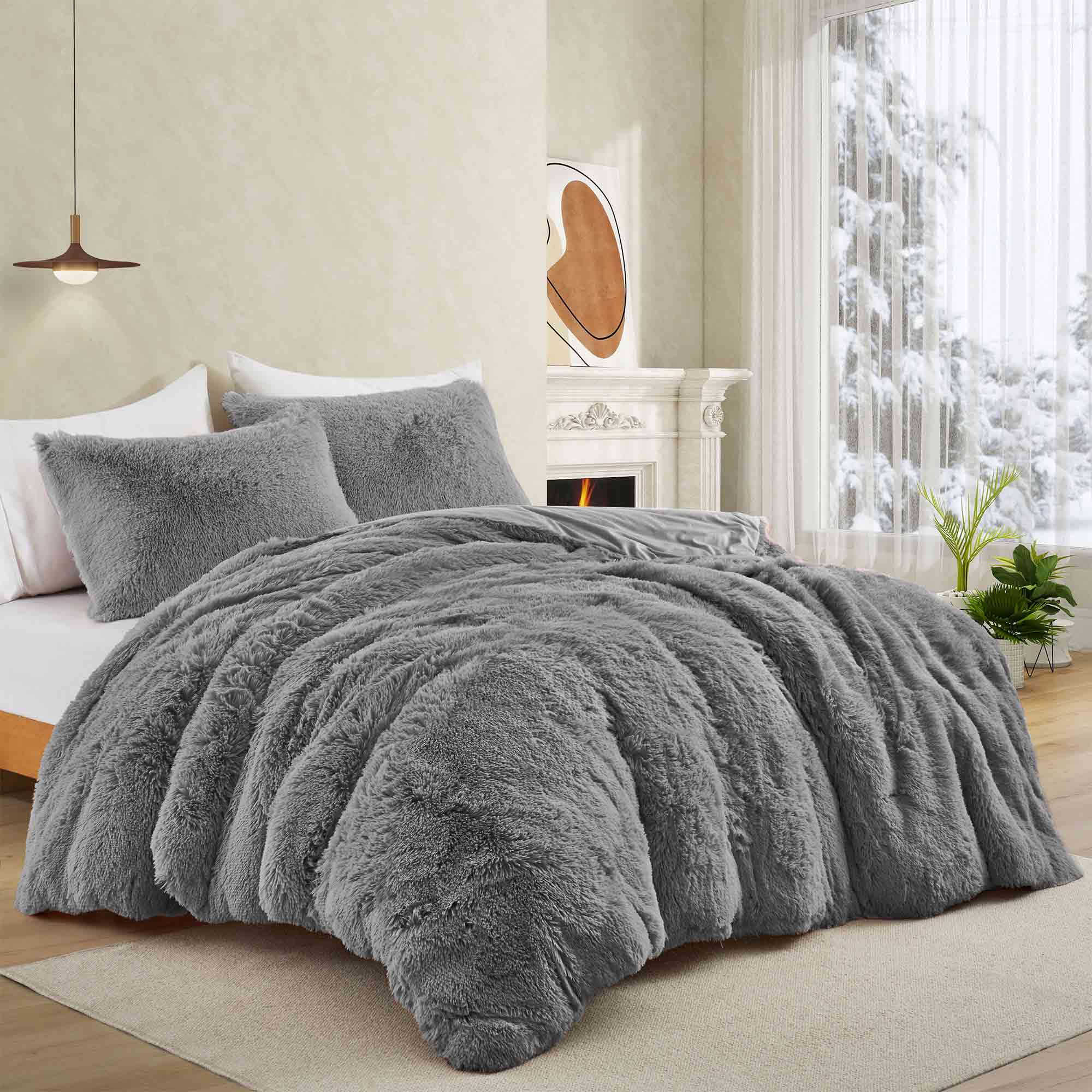 Add modern warmth to your bedroom with the 3-Piece Plush Reversible Faux Fur Comforter Set in Gray. Perfect for chilly seasons, the soft faux fur side offers cozy texture, while the sleek microfiber reverse adds versatility and style.