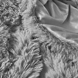 Add modern warmth to your bedroom with the 3-Piece Plush Reversible Faux Fur Comforter Set in Gray. Perfect for chilly seasons, the soft faux fur side offers cozy texture, while the sleek microfiber reverse adds versatility and style.