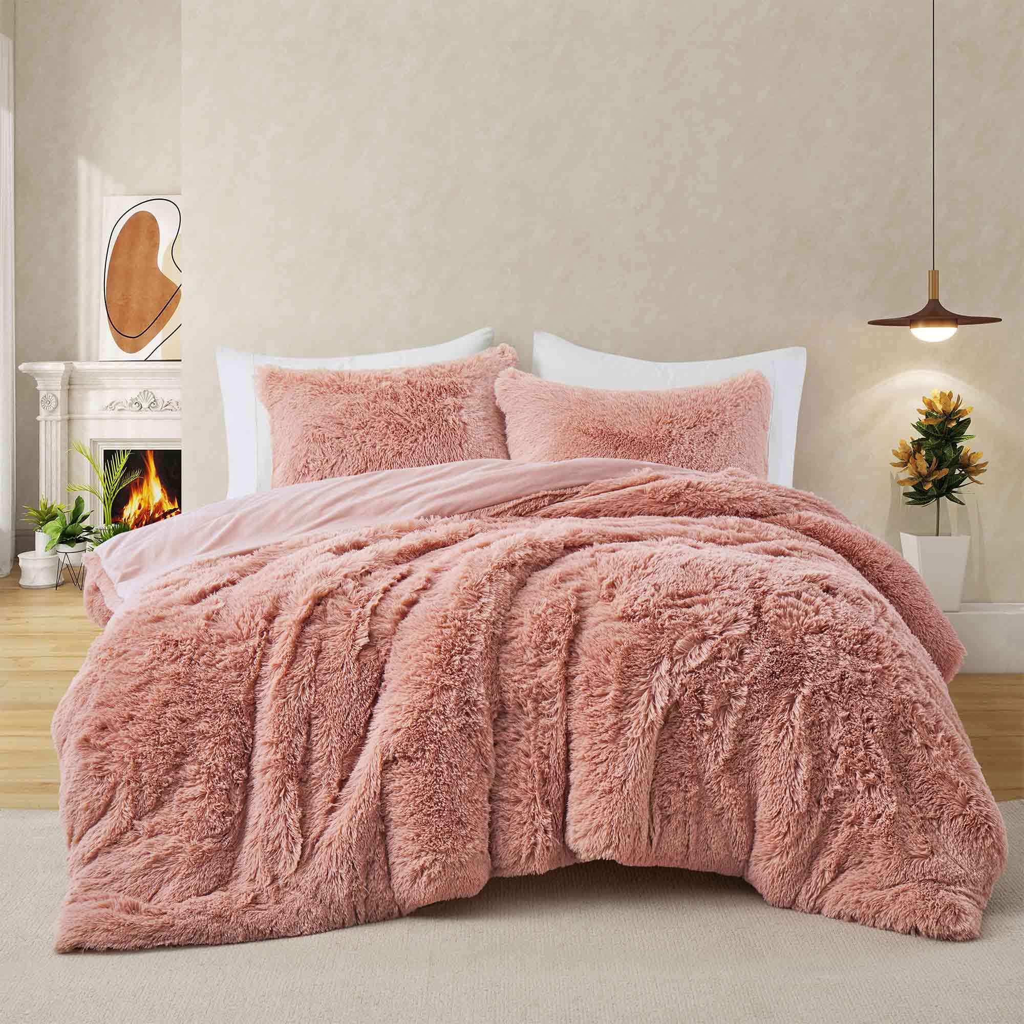 Bring a touch of romance to cold nights with the 3-Piece Plush Reversible Faux Fur Comforter Set in Pale Blush. The gentle pink shade enhances your décor, while plush faux fur and smooth microfiber keep you warm and comfortable