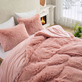 Bring a touch of romance to cold nights with the 3-Piece Plush Reversible Faux Fur Comforter Set in Pale Blush. The gentle pink shade enhances your décor, while plush faux fur and smooth microfiber keep you warm and comfortable