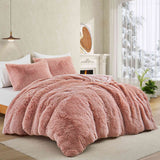 Bring a touch of romance to cold nights with the 3-Piece Plush Reversible Faux Fur Comforter Set in Pale Blush. The gentle pink shade enhances your décor, while plush faux fur and smooth microfiber keep you warm and comfortable