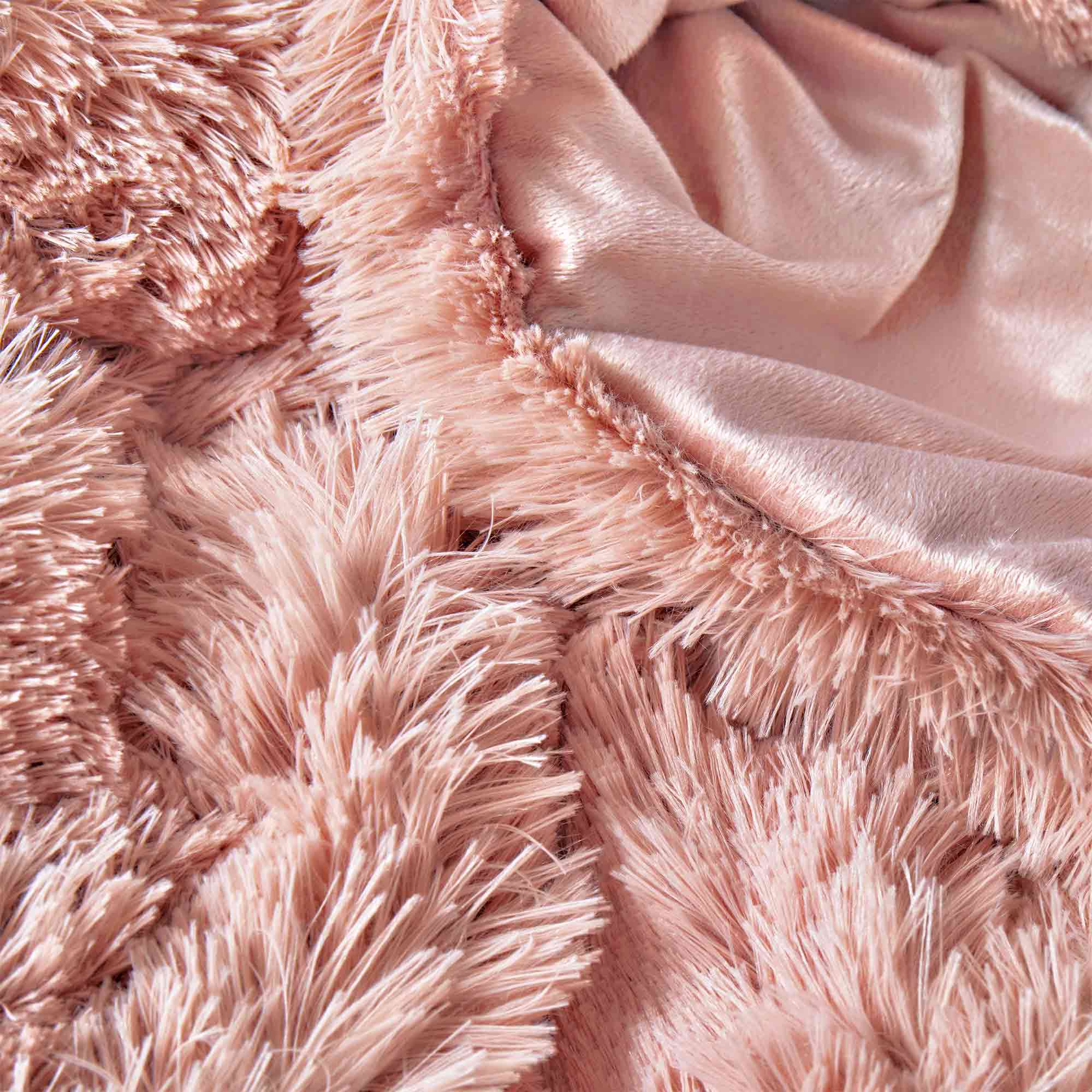 Bring a touch of romance to cold nights with the 3-Piece Plush Reversible Faux Fur Comforter Set in Pale Blush. The gentle pink shade enhances your décor, while plush faux fur and smooth microfiber keep you warm and comfortable.