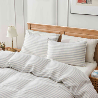 This linen bedding is covered in a refined gray and white textured stripe pattern. Experience the seamless blend of sophistication and simplicity with this gray stripe linen duvet cover set.