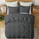 Deep charcoal gray duvet cover and pillowcases made from soft linen-cotton blend.