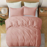 Soft rose taupe linen-cotton duvet cover and pillowcases in muted pink-beige.