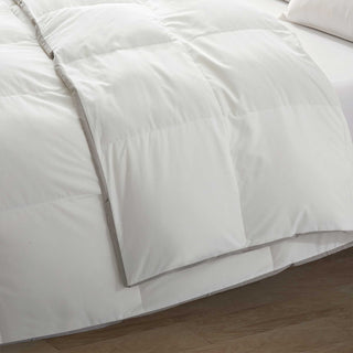 The all-natural blend comforter is brushed in the serene hues of white. Bring the all-season mirth to your bedroom with this feather goose down fiber comforter.