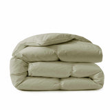 A neatly folded Premium Goose Feather Comforter in light beige, stacked on a white background.