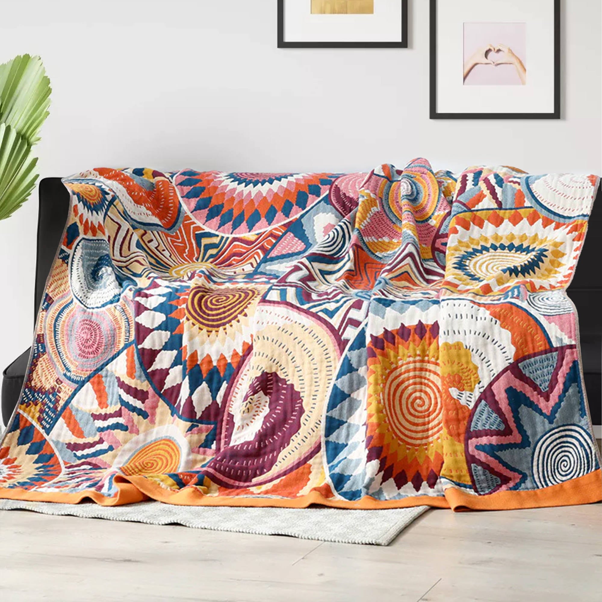 The couch blanket features abstract patterns of sunrise in vivid hues. Welcome the bright and shiny summers with this sweet blanket in Sunrise style.
