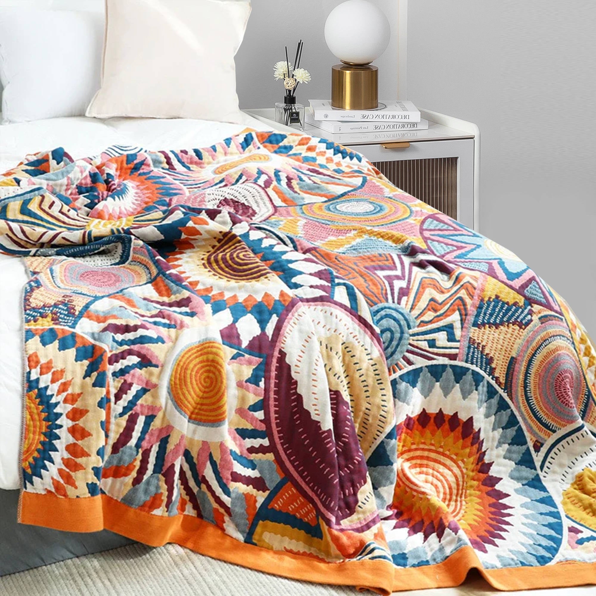 The couch blanket features abstract patterns of sunrise in vivid hues. Welcome the bright and shiny summers with this sweet blanket in Sunrise style.