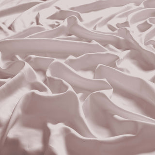 The Tencel Lyocell cooling sheet set is covered in the delicate shade of pink with hints of gray and beige. Create a serene and dreamy bedroom retreat with this eucalyptus bed sheet set in Misty Rose.