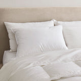 Made with down in pillows with feathers, this german down feather pillow is covered in crisp white hues. Add a touch of classic intrigue to your bedspace with this down feather pillow in white.