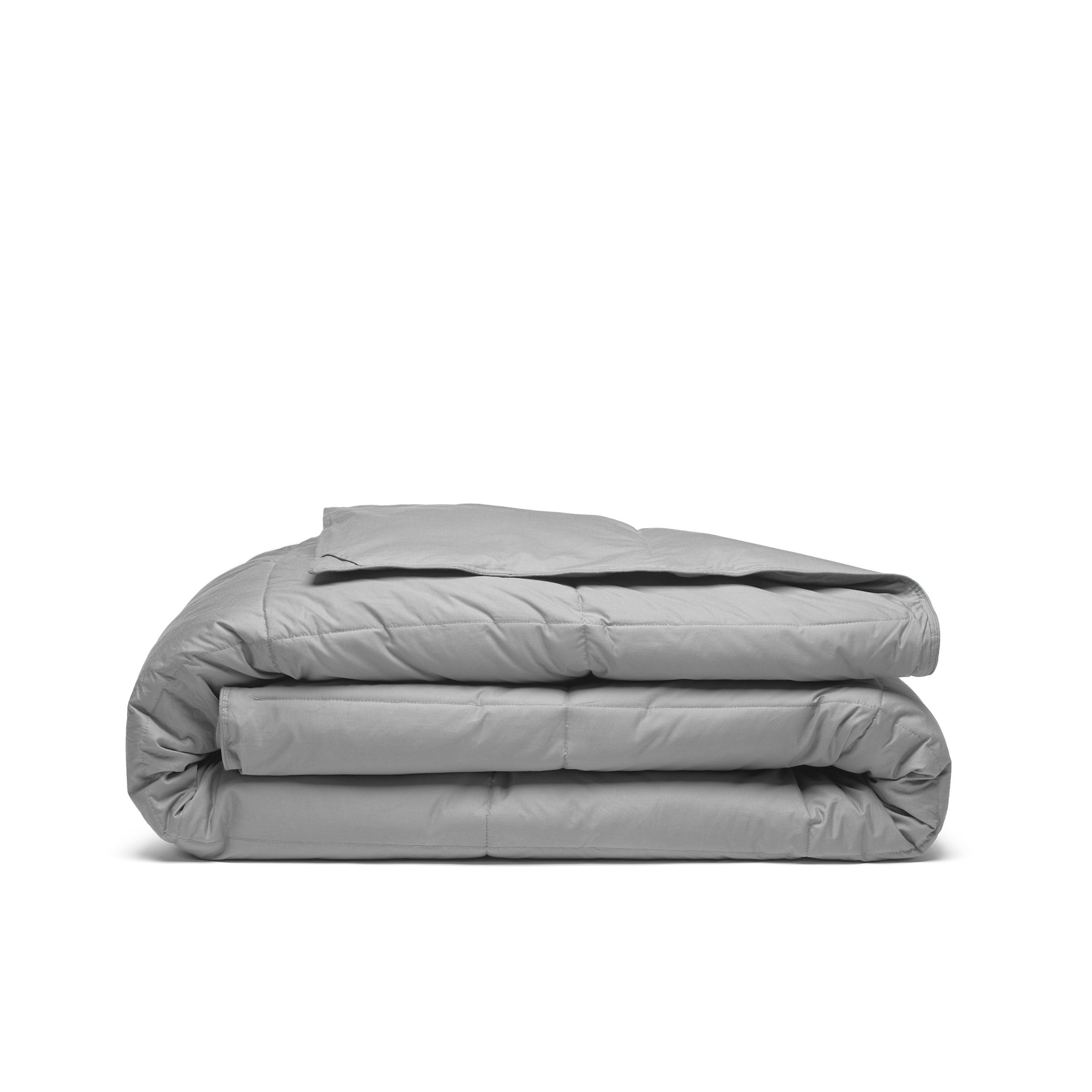 Indulge in the luxurious softness and durability of our organic comforter option in a versatile and chic gray shade, offering a cozy and sustainable way to enrich your sleep experience and enhance your bed in luxury style.