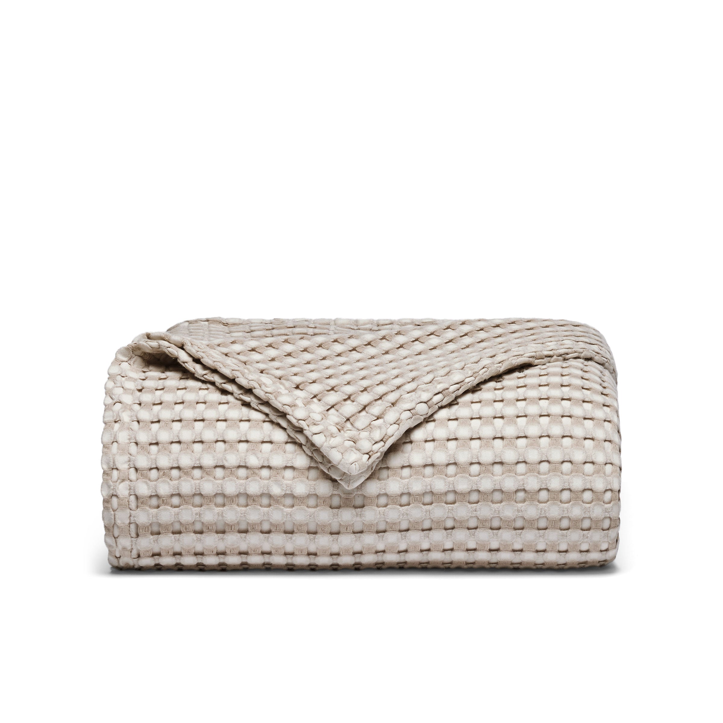 The all-weather blanket is covered in a beige color with soft camel undertones. Add a dimensional texture to your modern home décor with this perfectly pretty warm-season blanket for comfort.