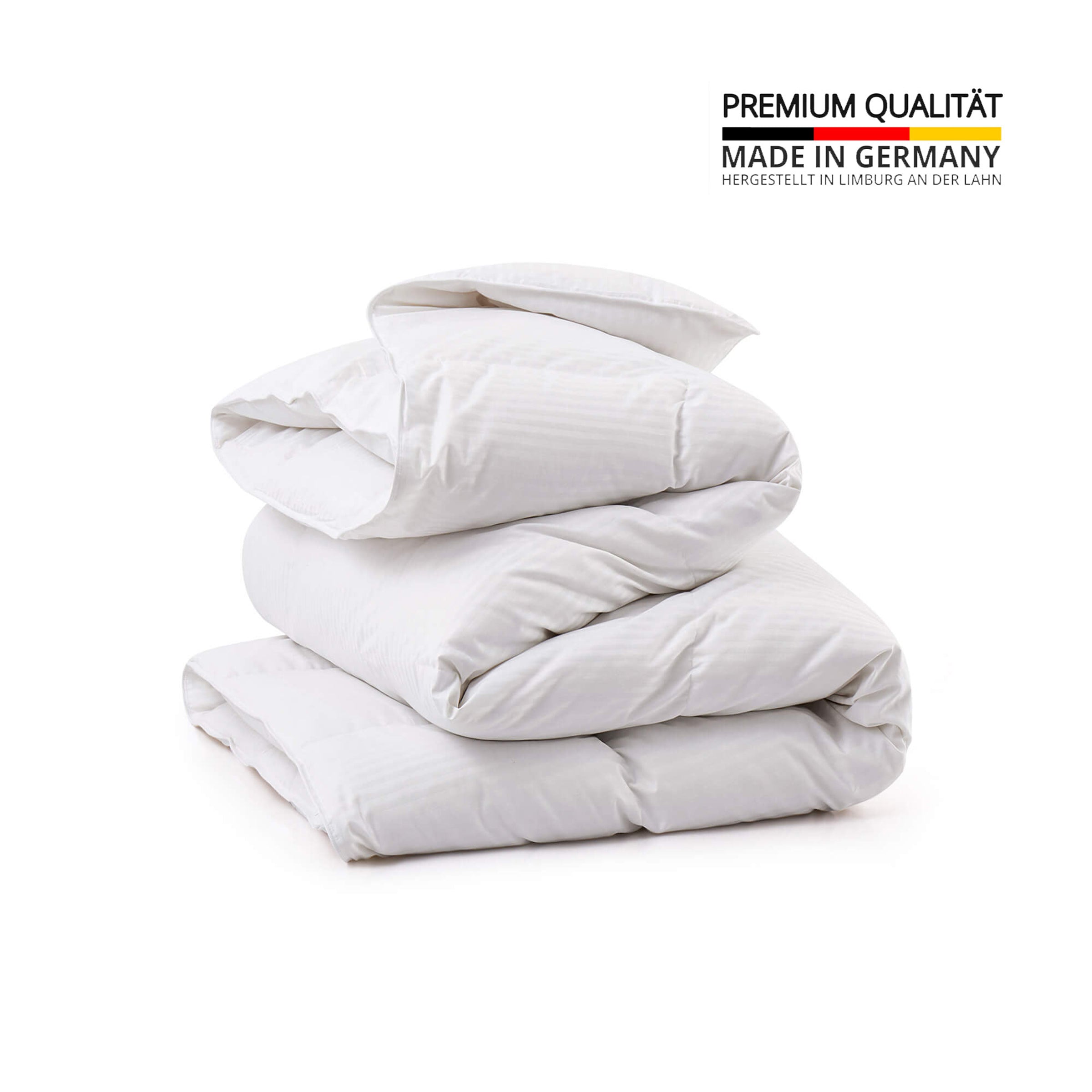 Crafted in Germany, this luxury down comforter features 90% white duck down in the medium weight and 90% white goose down in the extra warm version. With a soft, down-proof cotton shell and baffle box construction, it offers breathable warmth, even fill, and premium comfort—perfect for year-round or cold weather use.