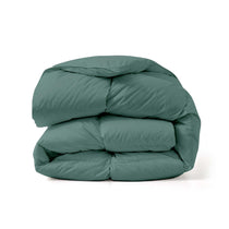 The down feather comforter is brushed in medium tones of forest green. Add a natural element to your bedroom style with this green color medium weight comforter.