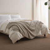 The all-weather blanket is covered in a beige color with soft camel undertones. Add a dimensional texture to your modern home décor with this perfectly pretty warm-season blanket for comfort.