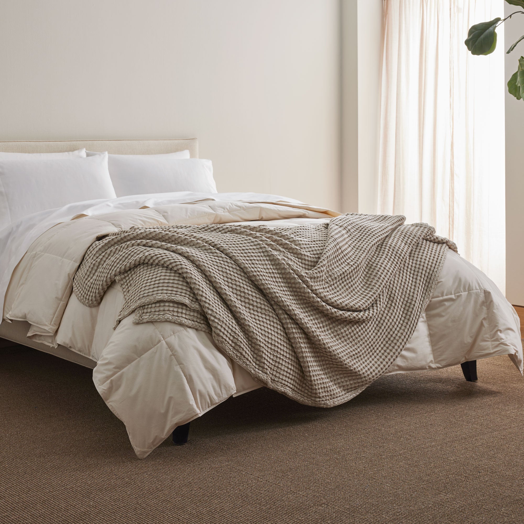 The all-weather blanket is covered in a beige color with soft camel undertones. Add a dimensional texture to your modern home décor with this perfectly pretty warm-season blanket for comfort.