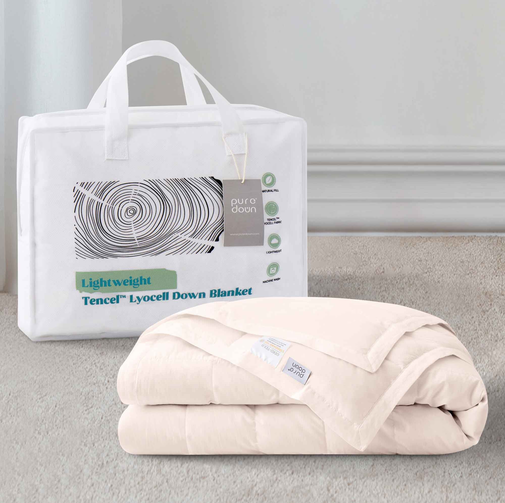 The down blanket is brushed in soft tones of pink. Add a touch of subtle beauty to your room with this cooling tencel lyocell blanket.