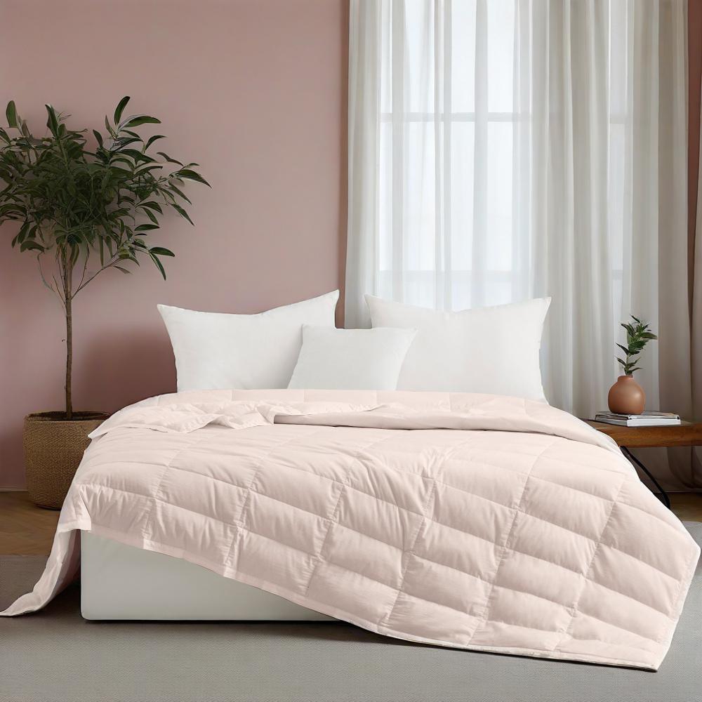 The down blanket is brushed in soft tones of pink. Add a touch of subtle beauty to your room with this cooling tencel lyocell blanket.