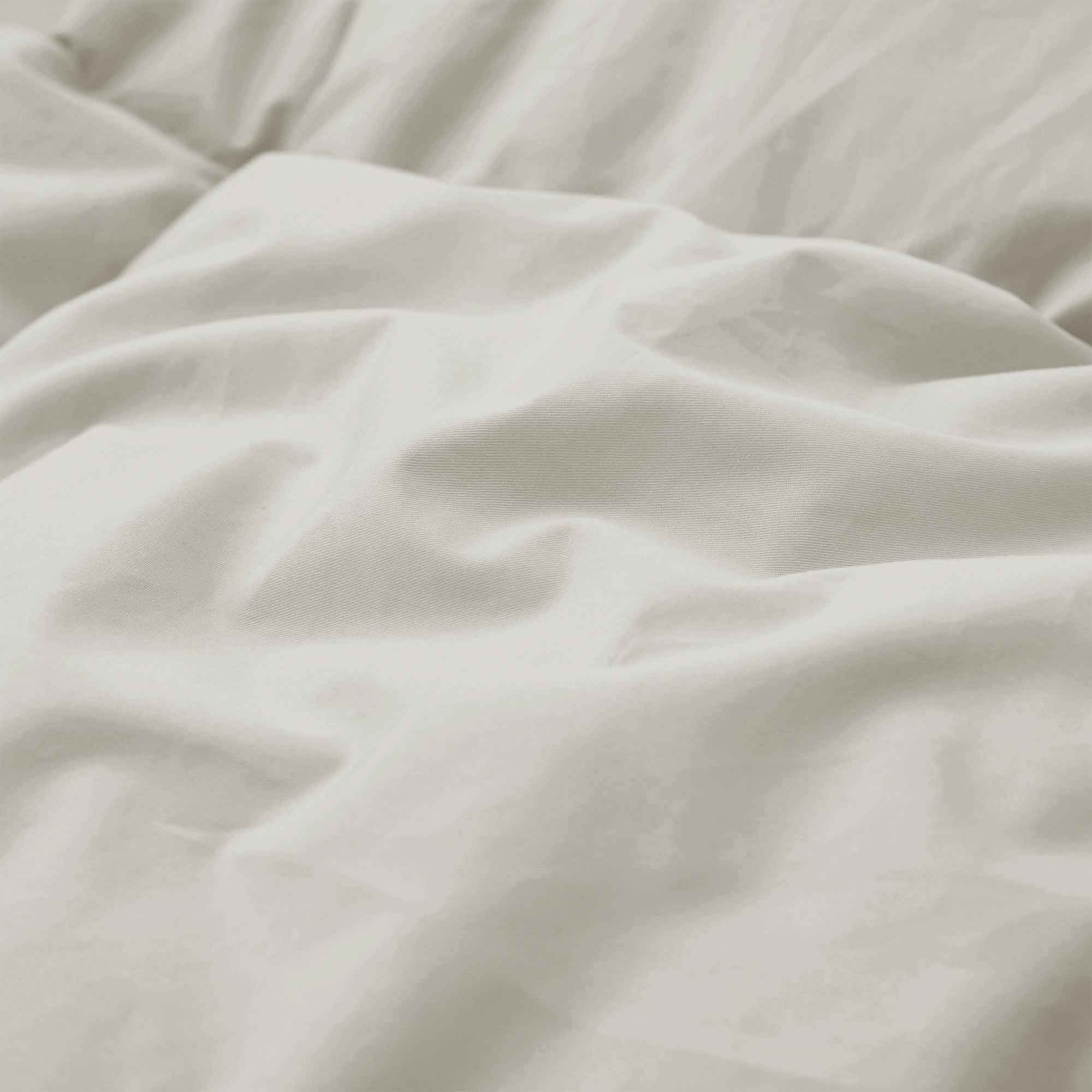 Add natural warmth and texture to your bedroom with our Oatmeal Organic Cotton Down Comforter. The soft, earthy oatmeal tone brings a calming, neutral aesthetic that blends effortlessly with modern, rustic, or minimalist decor. Made with GOTS-certified organic cotton and filled with 100% down and feather fiber, this comforter delivers breathable, all-season comfort with a cloud-like feel. Lightweight yet cozy, it's perfect for year-round use, offering natural insulation and moisture-wicking properties to he
