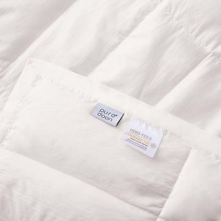 This cool blanket is covered in pristine hues of white. Enjoy the coolest sleep every night with this white down and feather blanket.