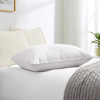 Made with down in pillows with feathers, this german down feather pillow is covered in crisp white hues. Add a touch of classic intrigue to your bedspace with this down feather pillow in white.