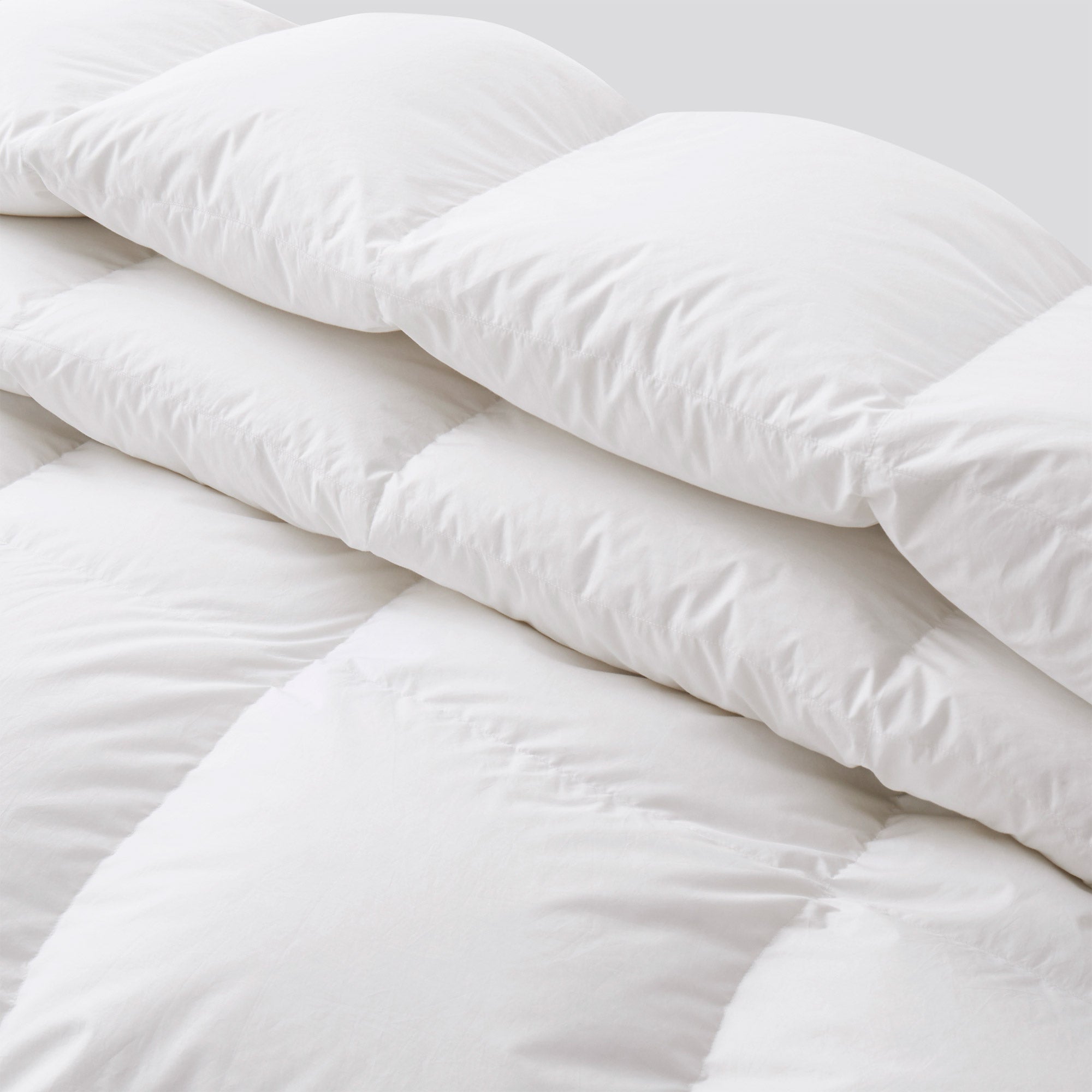 The warm comforter is covered in beautiful tones of white. A valuable element in your bedding décor, let this white comforter add a touch of classic intrigue to your bedding space.