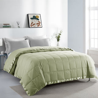 The down feather blanket with satin trim is colored in the soft tones of pale green. Bask in the tranquility of nature with the oversized bed blanket in Pale Green.