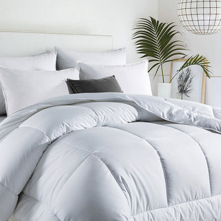 The alternative down comforter is covered in solid colors of white. Bring a touch of style to your modern bedroom design with this mid – weight comforter.