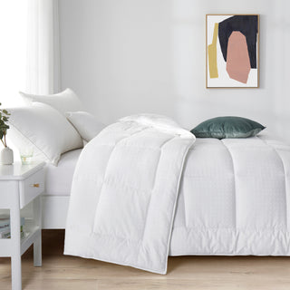 The alternative down comforter is covered in solid colors of white. Bring a touch of style to your modern bedroom design with this mid – weight comforter.
