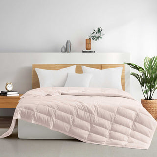 The down blanket is brushed in soft tones of pink. Add a touch of subtle beauty to your room with this cooling tencel lyocell blanket.