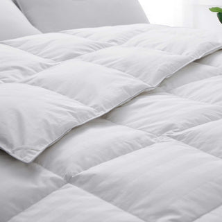 The feather material comforter is encased in soft white shades. Bring a millennial vibe to your bedroom decor with endless comfort with this white feather comforter.