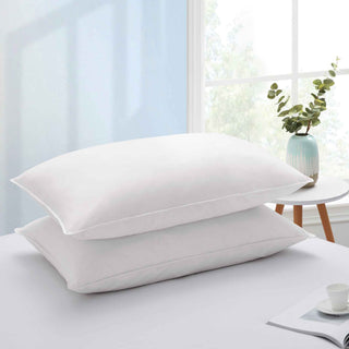 The plush pillow design is colored in the harmonious tones of white. Add a welcoming feel and luxurious comfort to your bedroom space with these overstuffed feather pillows.