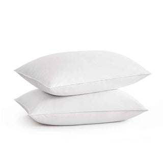 The plush pillow design is colored in the harmonious tones of white. Add a welcoming feel and luxurious comfort to your bedroom space with these overstuffed feather pillows.