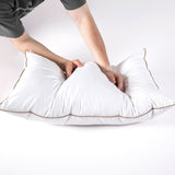 The Puredown down plush pillow is colored in soft tones of white. Bring a sense of minimalism to your bedroom space with these goose feather pillows.