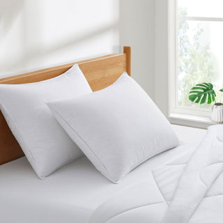 The pillows are enveloped in serene tones of white. Bring a fresh ray of sunshine to your bedroom décor with these feather and down pillows in white.