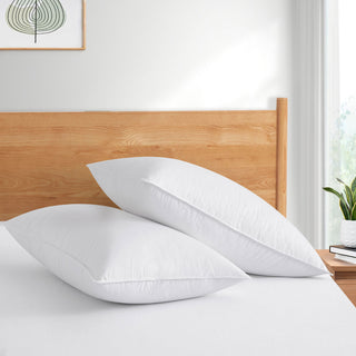 The pillows are enveloped in serene tones of white. Bring a fresh ray of sunshine to your bedroom décor with these feather and down pillows in white.