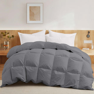 The goose down comforter is enveloped in smoky grey tones. Add a touch of minimal style to your bedroom decor with this all-seasons comforter.