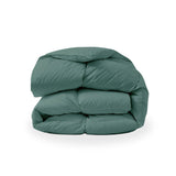 The down feather comforter is brushed in medium tones of forest green. Add a natural element to your bedroom style with this green color medium weight comforter.