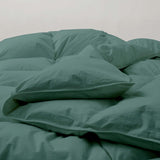 The down feather comforter is brushed in medium tones of forest green. Add a natural element to your bedroom style with this green color medium weight comforter.