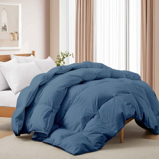 The feather down comforter is covered in navy blue hues. Infuse elegant and breathable style into your personal space for a comfortable night’s sleep with this double stitching design comforter.