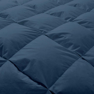 The feather down comforter is covered in navy blue hues. Infuse elegant and breathable style in your personal space with this double stitching comforter.
