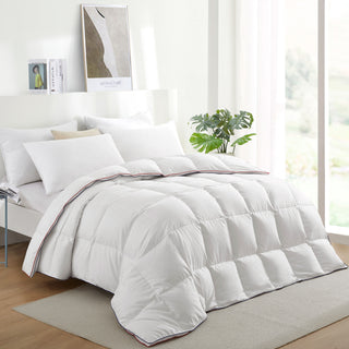 The all season down comforter is covered in the solid colors of white. Create a light and bright atmosphere in your room with this baffle-box comforter.