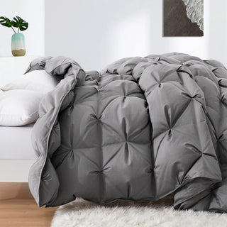 Transform your bedroom into a serene and tranquil oasis with our goose down comforter in a chic and versatile grey shade. This grey down comforter offers a cozy and stylish way to stay warm and comfortable all night long.